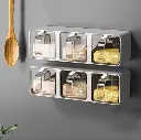 Organizador de cocina pegable de pared porta condimentos plástico 27x8x8 cm UND marca DAXUZ